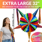 girl looking up at large mexican star piñata