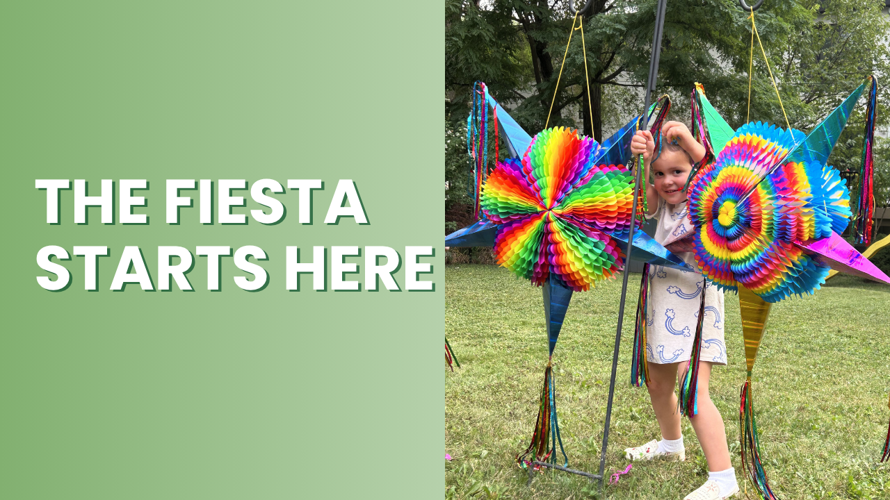 Child holding a colorful pinata with text 'The Fiesta Starts Here' on a green background