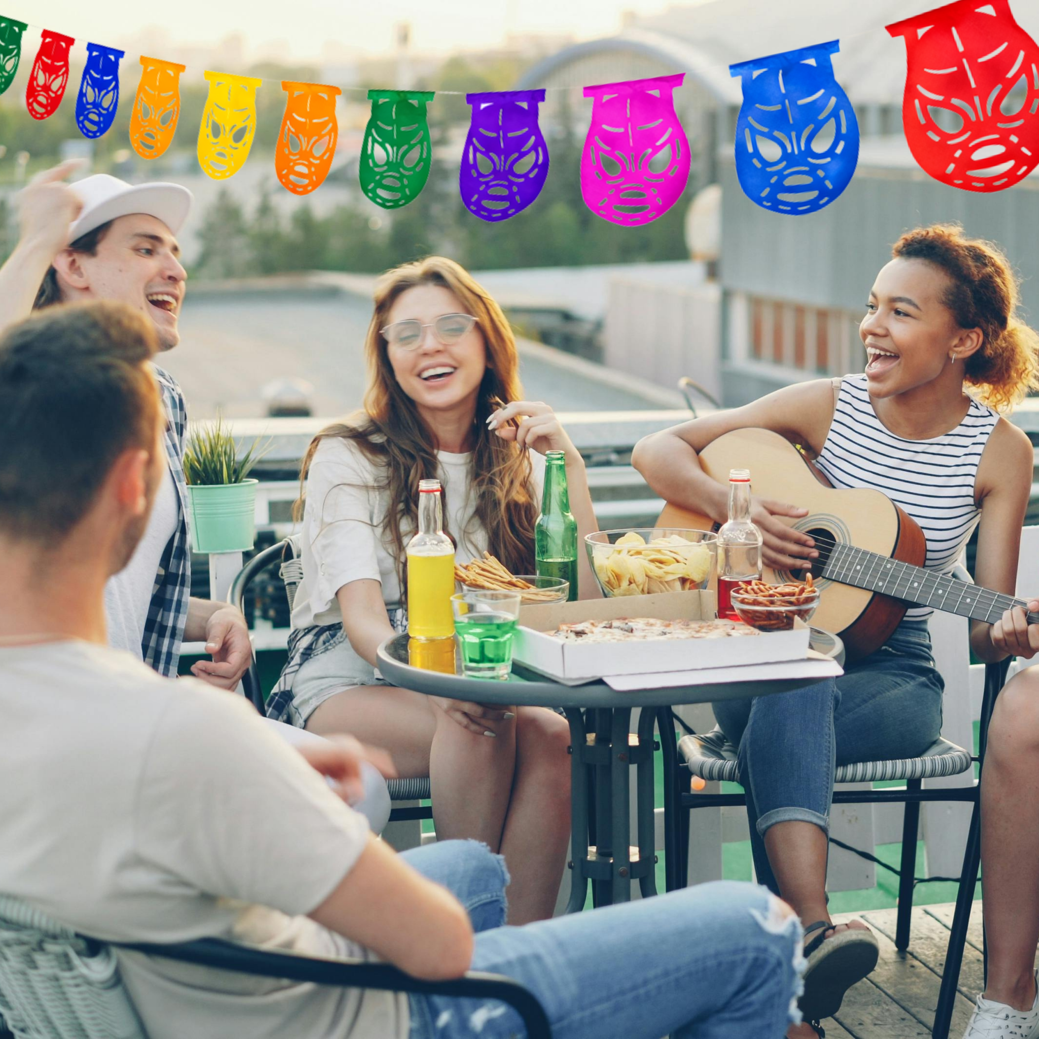 lucha libre masks outdoor party at table with guitar